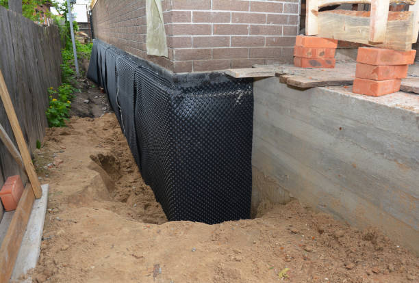 SJ Waterproofing Pros technician performing targeted Emergency Waterproofing assessment in Athens, OH